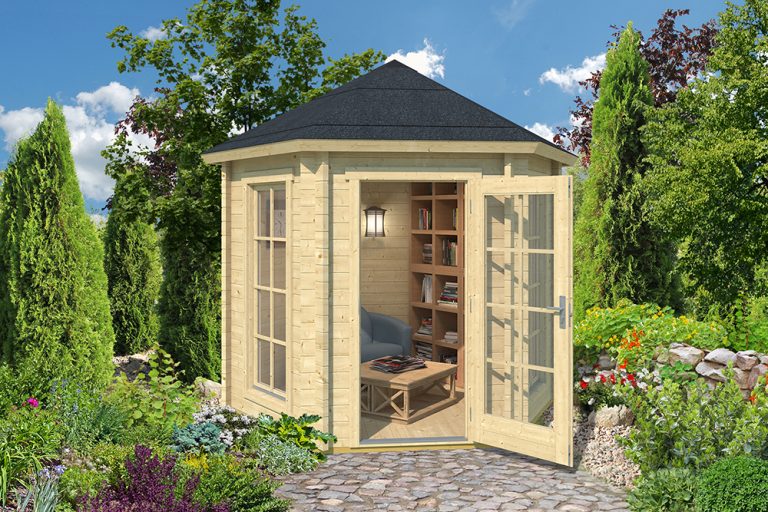 A small, light-coloured wooden shed with glass doors and windows stands in a garden, containing a chair and books.